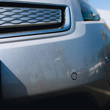 Bugs on car bumper being removed with Bug & Tar sponge
