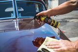 Eco Wash Waterless Wash being sprayed to remove light dust from car paint on this Cord Grande