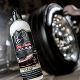 Using Tire and Trim Care tyre dressing for a classic finish on car tyres.